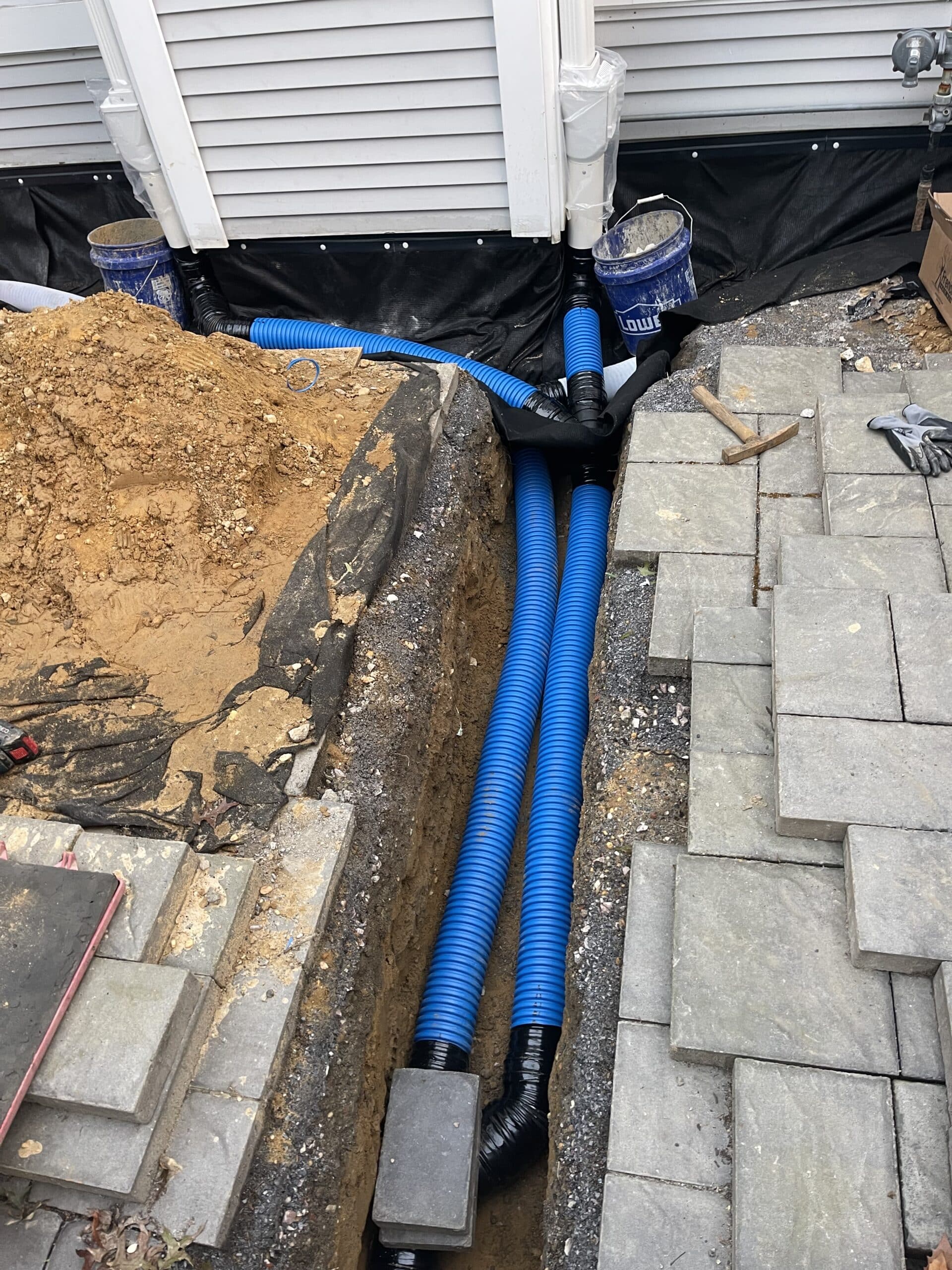 Townhouse Complex Exterior Drainage Solution – before photo 1