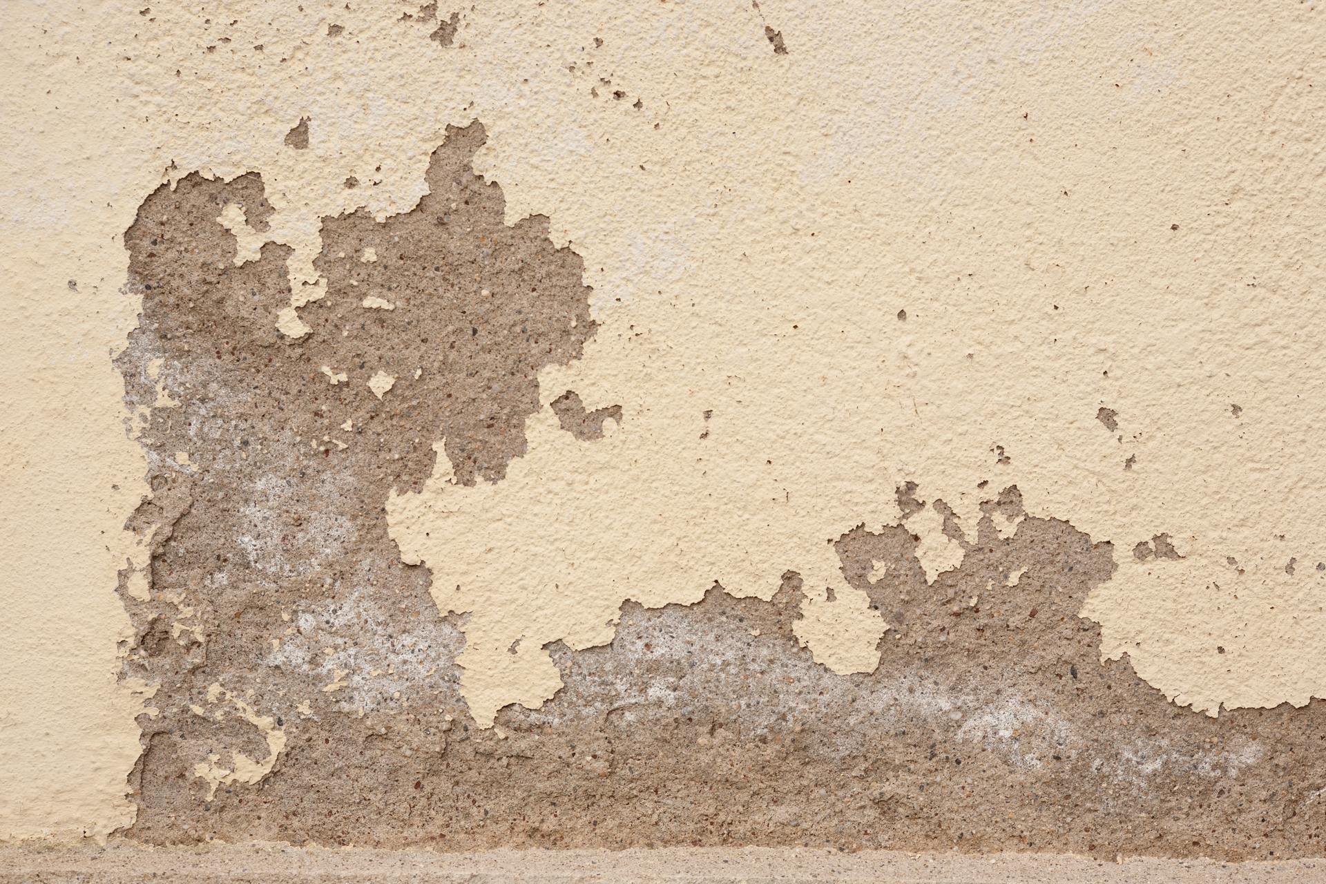 Carbon fiber strips applied to a foundation wall crack