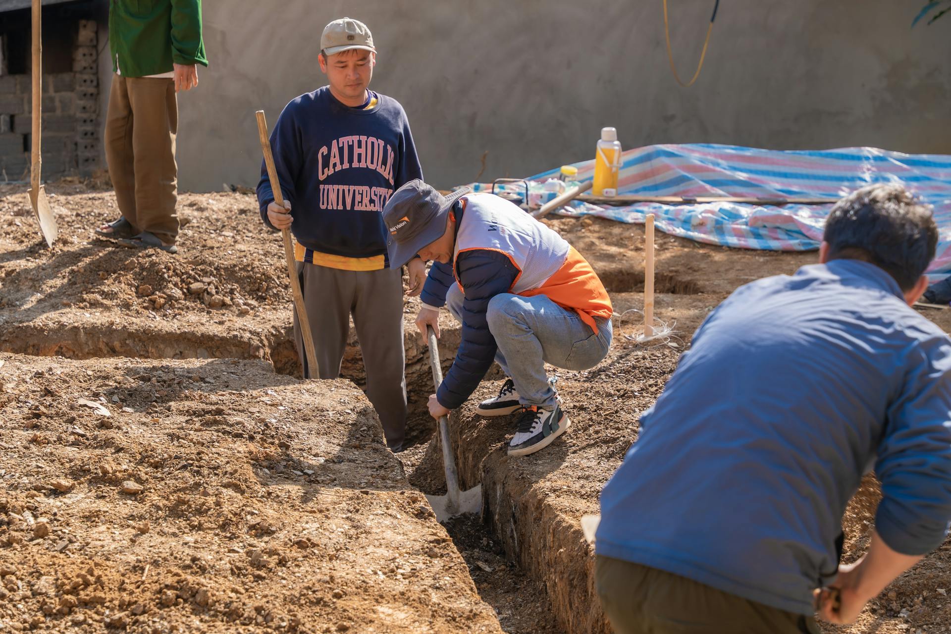 Exterior French drain system being installed